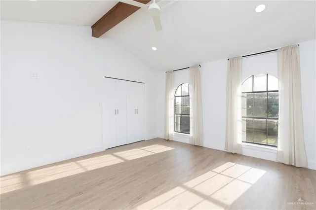 a bathroom with a sink a toilet and a large mirror