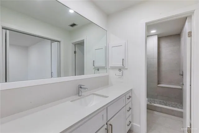 a bathroom with a shower and toilet
