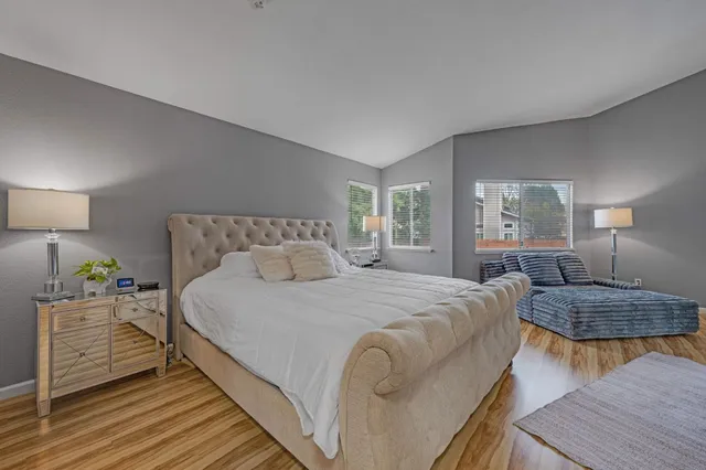 a bedroom with bed and window