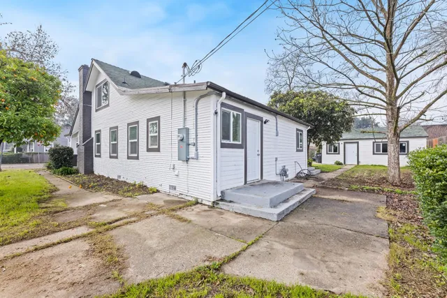 front view of a house with a yard