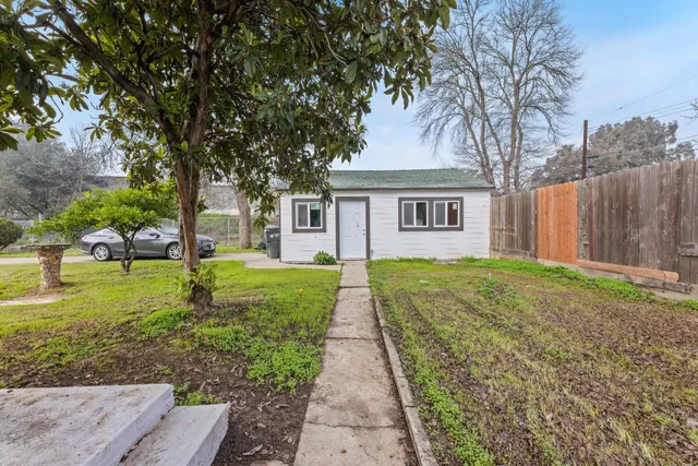 a view of an empty room with wooden walls