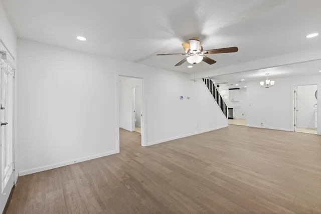 an empty room with fan and a ceiling fan
