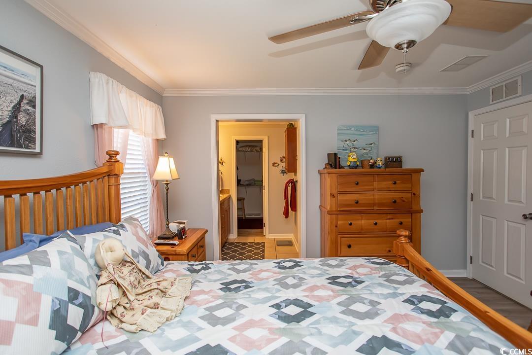 318 Walden Lake Road Conway, SC 29526 - Photo 15 of 33 Bedroom featuring connected bathroom, light hardwo