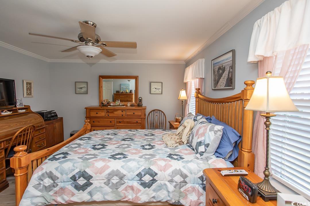 318 Walden Lake Road Conway, SC 29526 - Photo 16 of 33 Bedroom with ceiling fan and ornamental molding