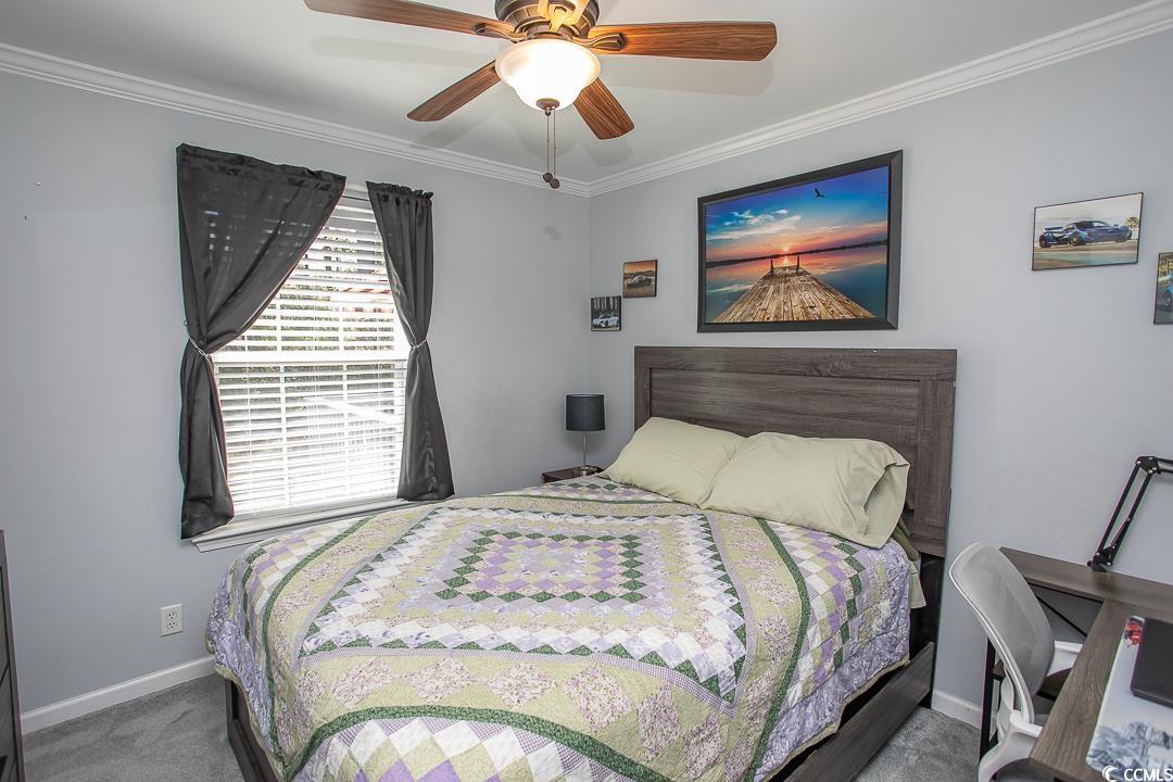 318 Walden Lake Road Conway, SC 29526 - Photo 25 of 33 Bedroom with carpet floors, ceiling fan, and ornam