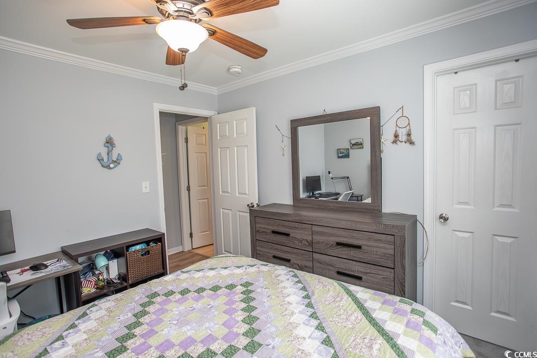 318 Walden Lake Road Conway, SC 29526 - Photo 26 of 33 Bedroom with ceiling fan and ornamental molding