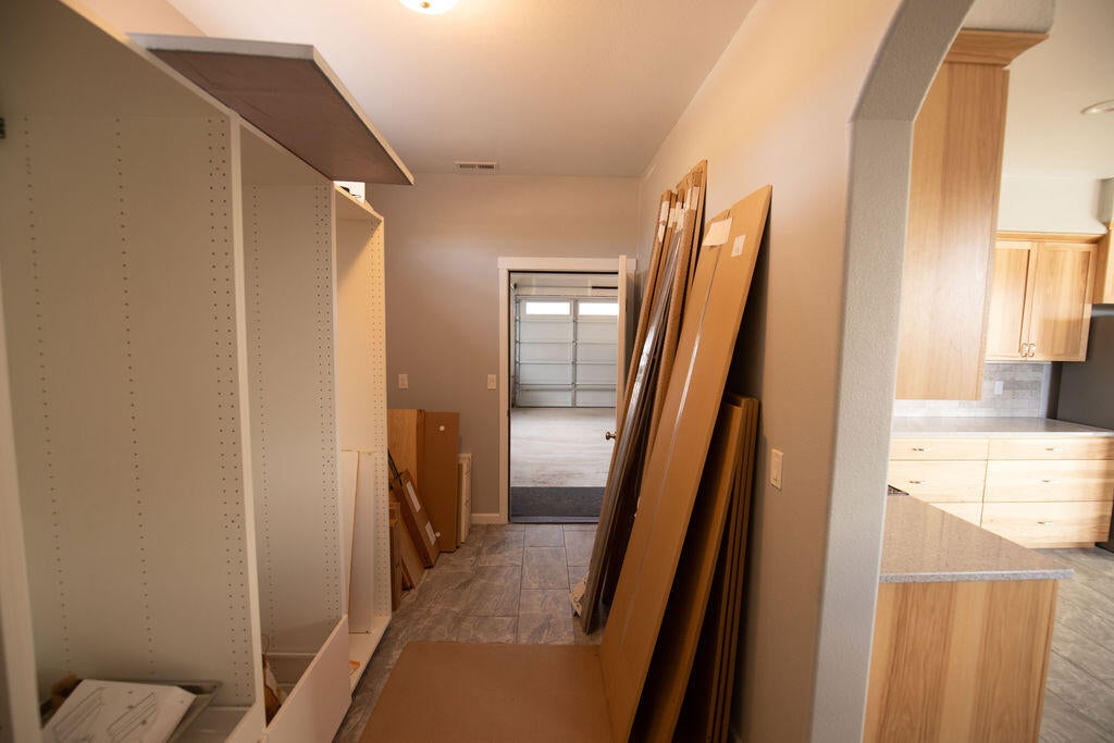 23775 Dodds Road Bend, OR 97701 - Photo 20 of 67 Walk-through pantry with access to garage. Partially installed Ikea pantry system included.