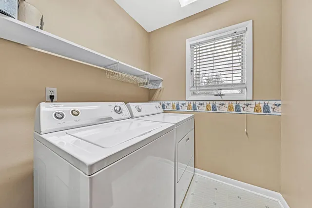 a utility room with washer and dryer