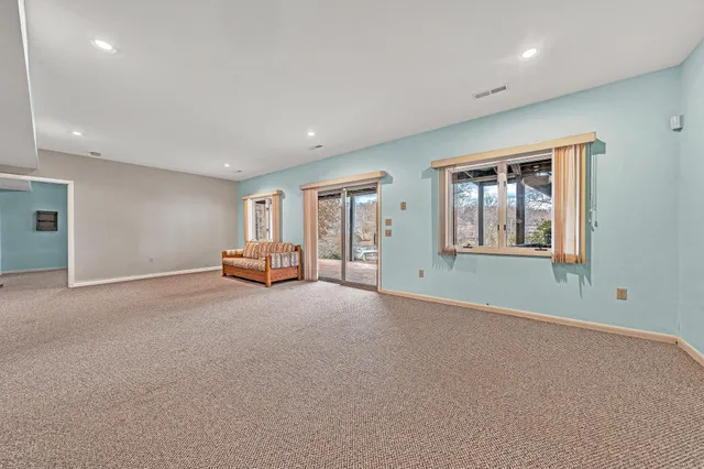 a big room with windows and closet