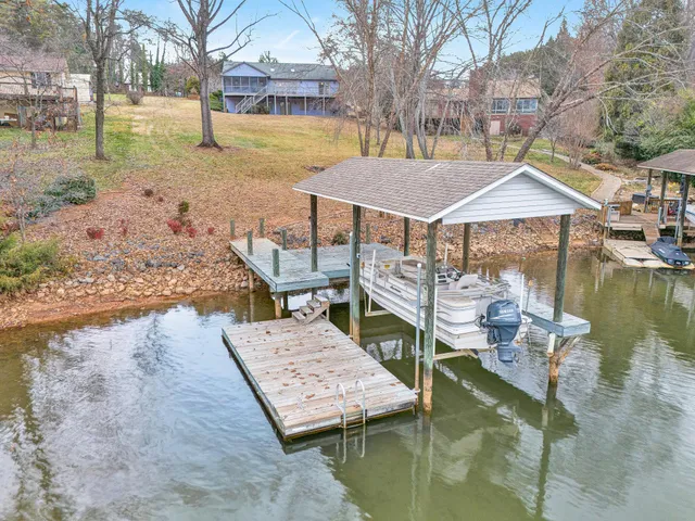 a wooden deck with lake view