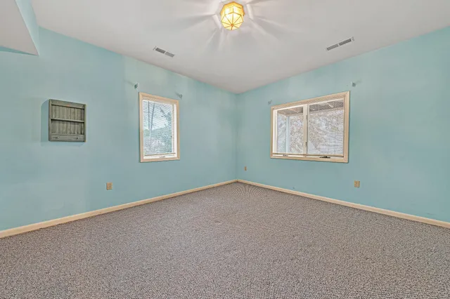 a view of an empty room with stairs