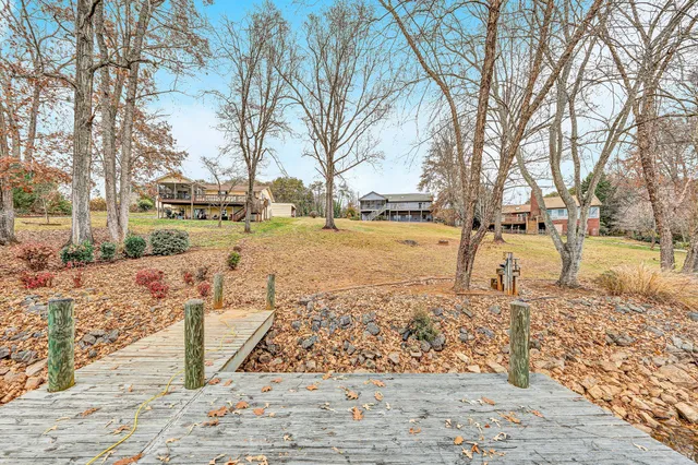 an aerial view of a house with a lake view