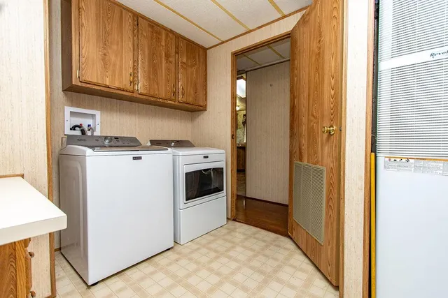a view of a kitchen with washer and dryer