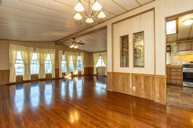 a view of an entryway with wooden floor