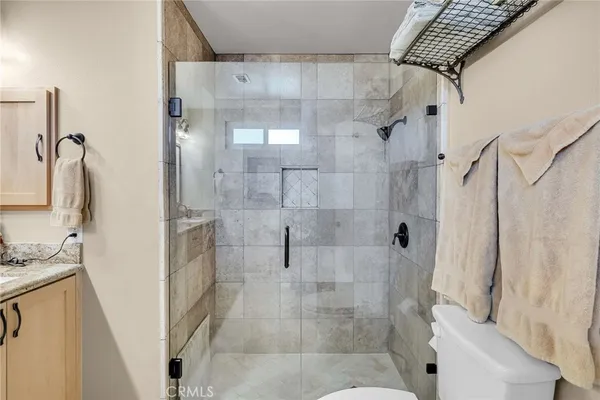 a bathroom with a shower and a sink