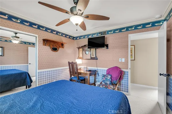 a bedroom with furniture and a window