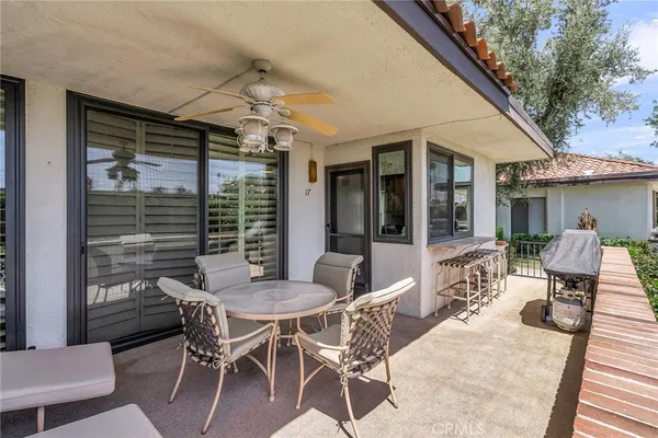 a patio with table and chairs
