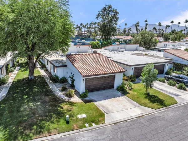 an aerial view of residential houses and outdoor space