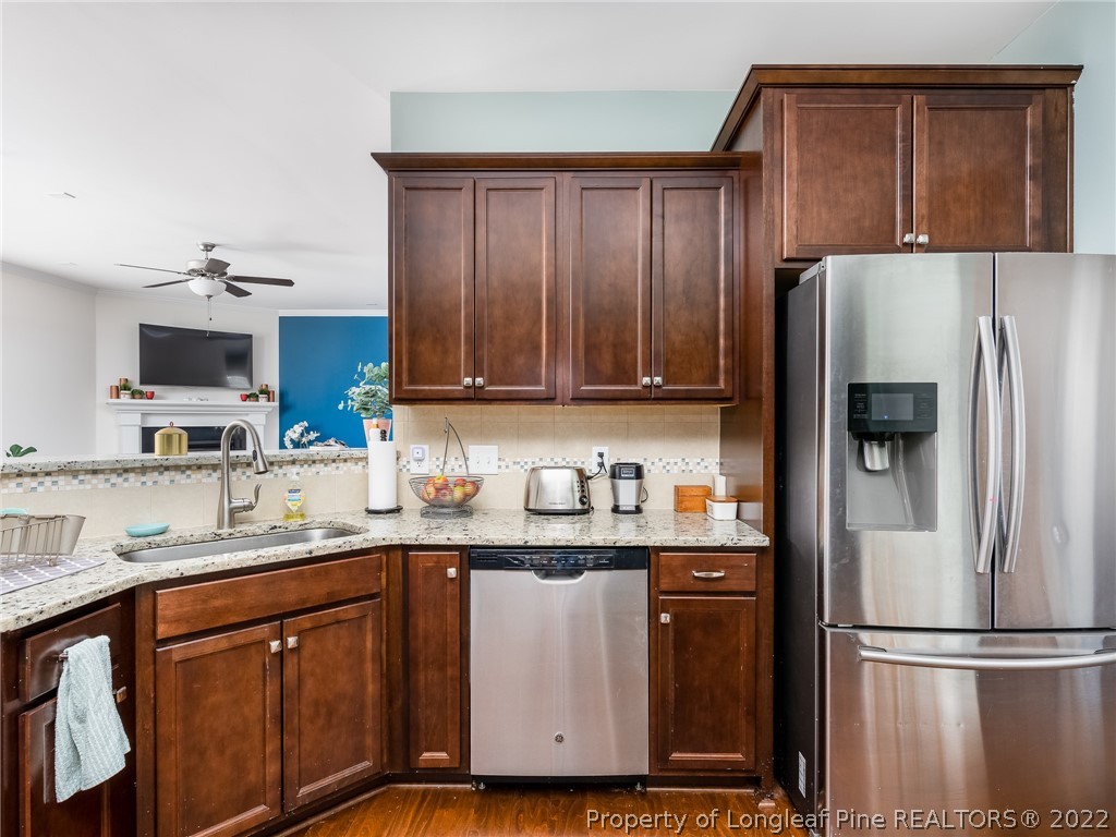 5137 Boxcut Lane Hope Mills, NC 28348 - Photo 11 of 48 a kitchen with stainless steel appliances granite countertop a refrigerator and a sink