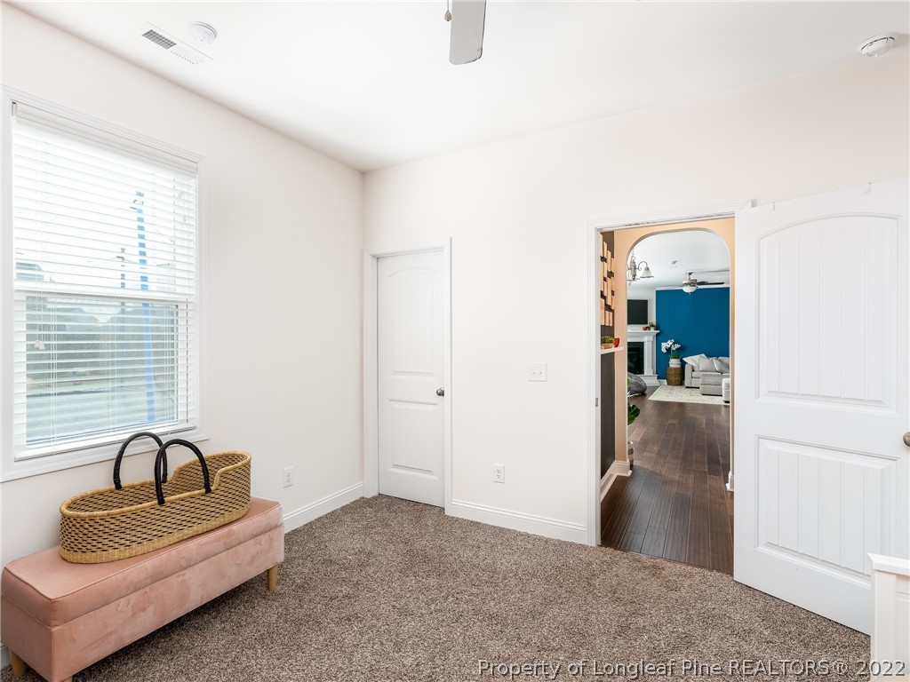 5137 Boxcut Lane Hope Mills, NC 28348 - Photo 21 of 48 a view of a livingroom with a couch and wooden floor