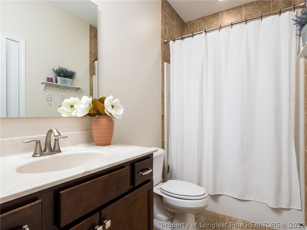 5137 Boxcut Lane Hope Mills, NC 28348 - Photo 23 of 48 a bathroom with a sink and a mirror