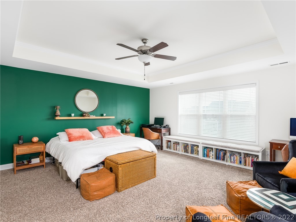 5137 Boxcut Lane Hope Mills, NC 28348 - Photo 24 of 48 a bedroom with a bed gym equipment and a large window