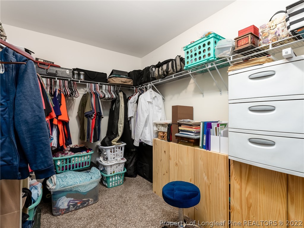5137 Boxcut Lane Hope Mills, NC 28348 - Photo 27 of 48 a view of walk in closet with clothes and shoes