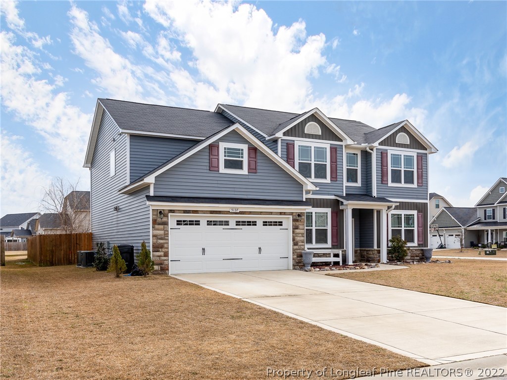 5137 Boxcut Lane Hope Mills, NC 28348 - Photo 4 of 48 a front view of a house with a yard