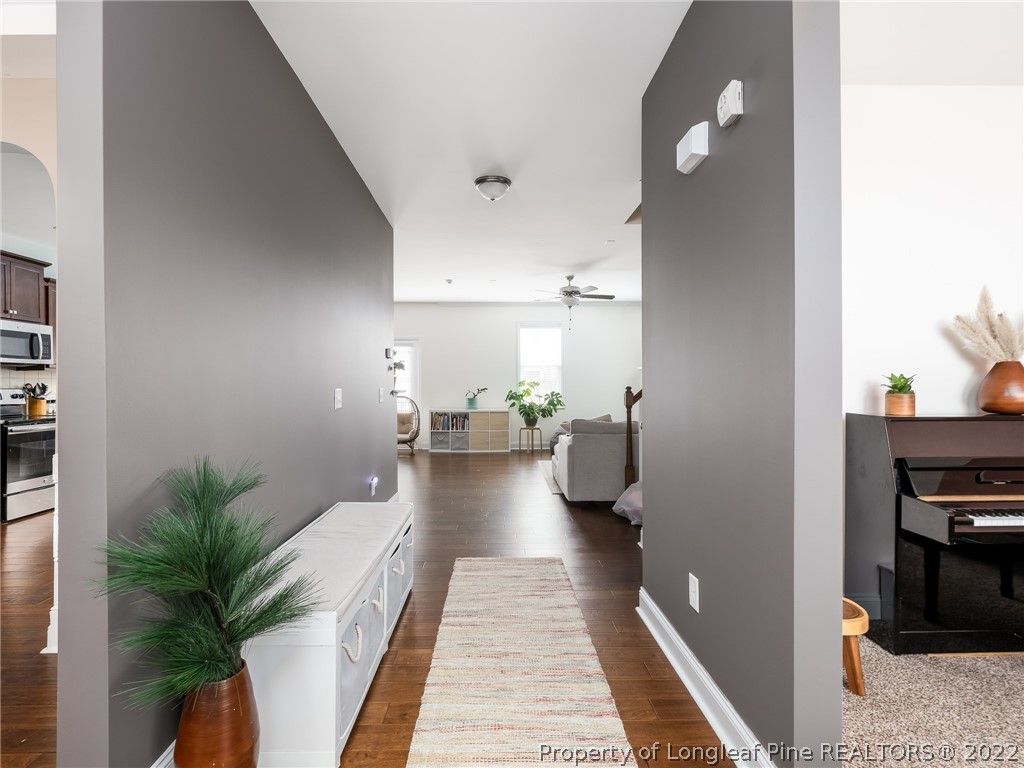 5137 Boxcut Lane Hope Mills, NC 28348 - Photo 5 of 48 a hallway with a potted plant on the kitchen counter top and sink
