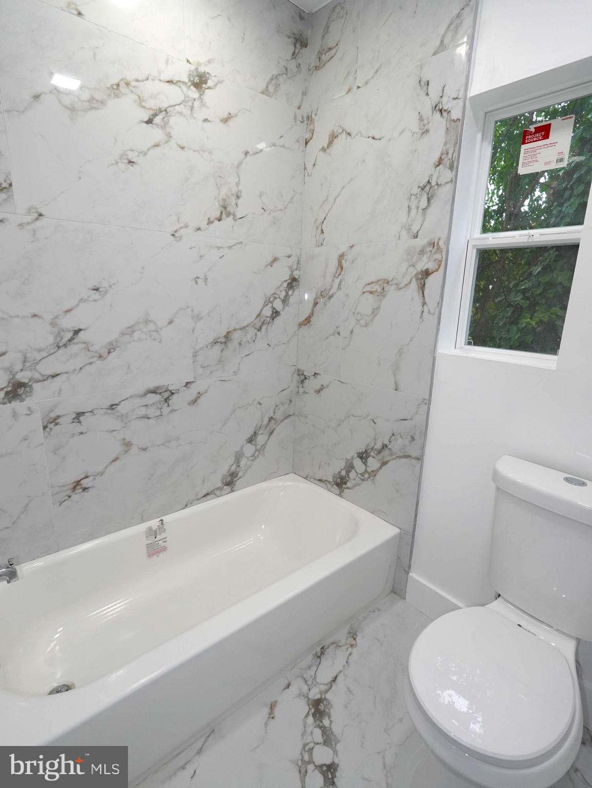 3200 Calvert Avenue, Unit C Haddon Township, NJ 08107 - Photo 7 of 8 a bathroom with a toilet and a bathtub