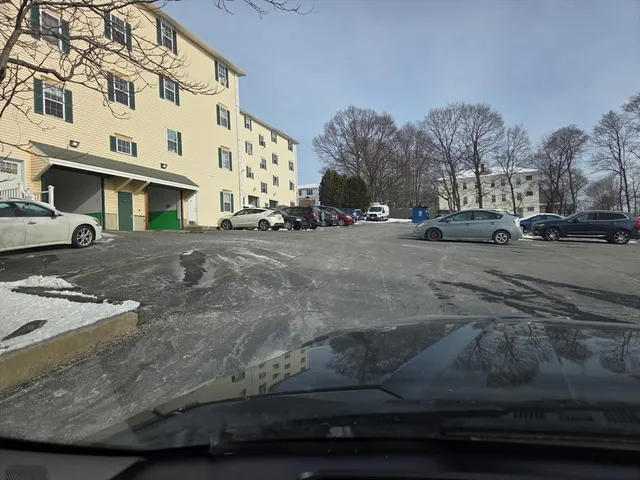 a view of a street with a building in the background