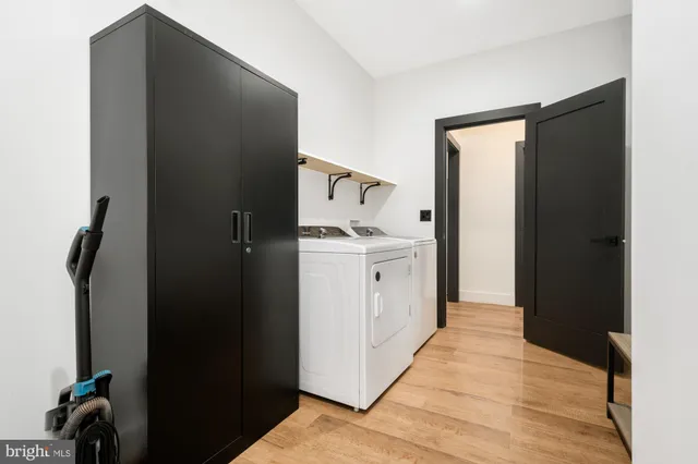 a kitchen with a refrigerator and a sink