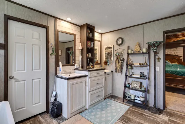 a spacious bathroom with a double vanity sink and a mirror