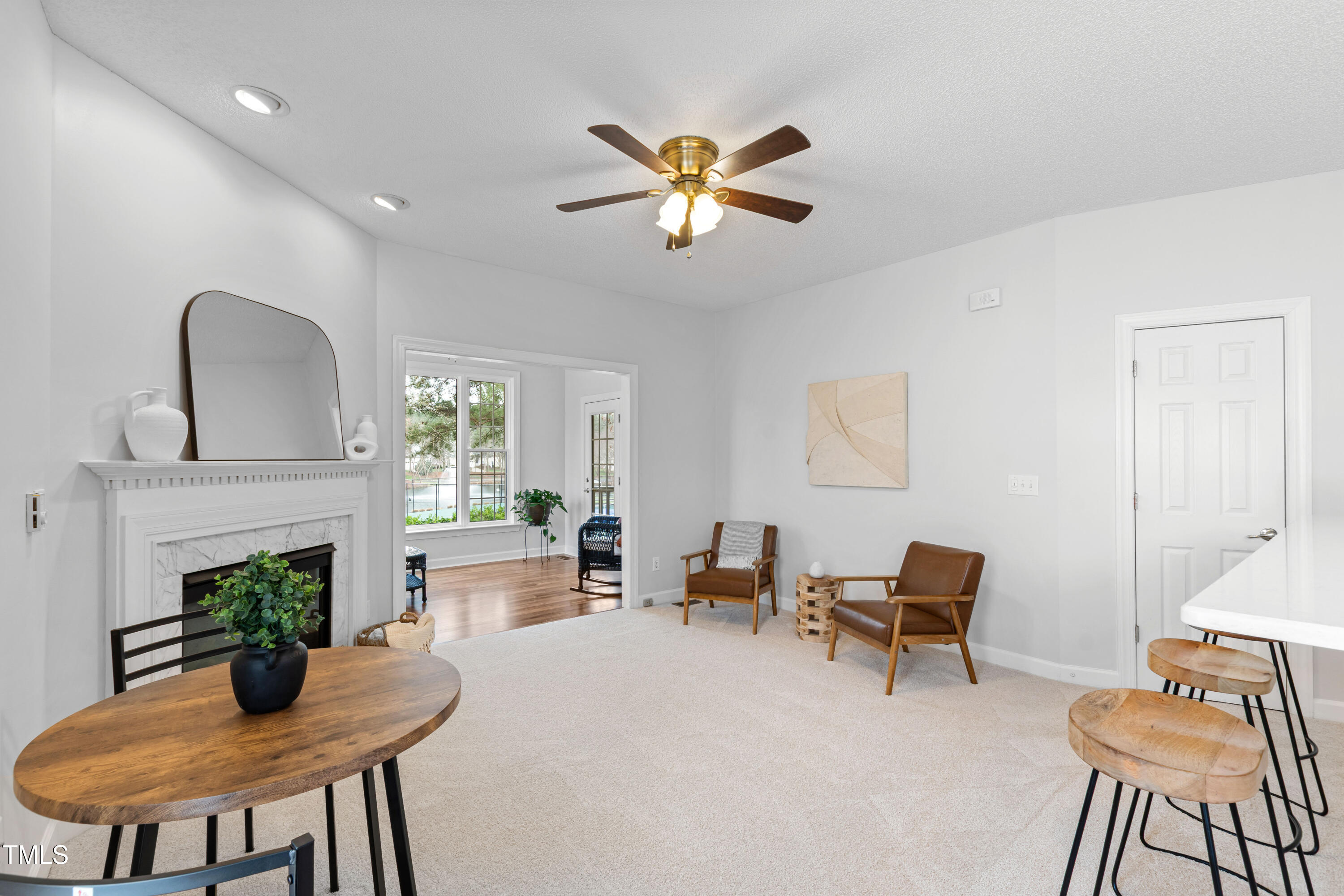 2024 Heritage Pines Drive Cary, NC 27519 - Photo 15 of 31 a dining room with furniture and a fireplace