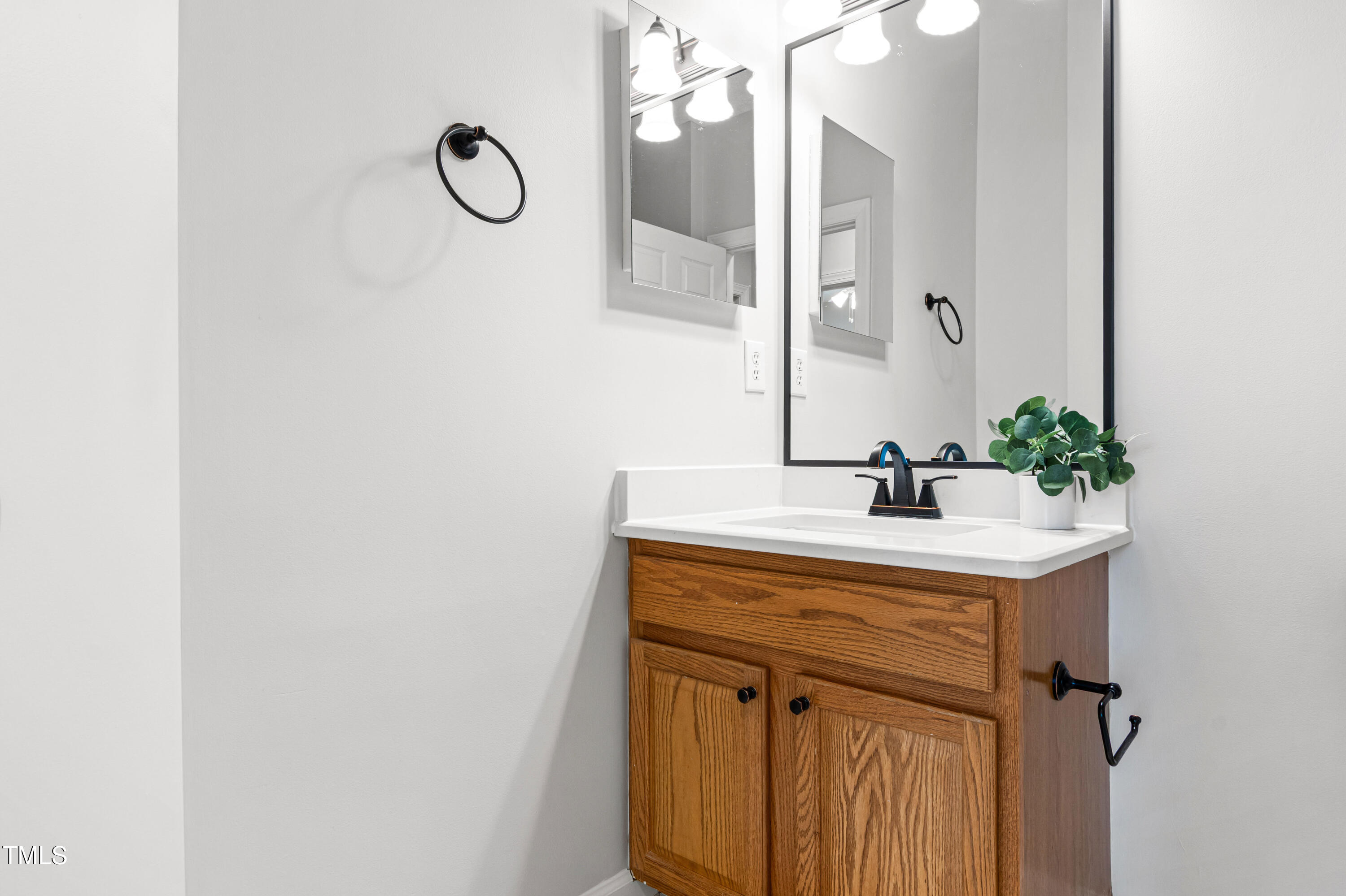 2024 Heritage Pines Drive Cary, NC 27519 - Photo 26 of 31 a bathroom with a sink and a mirror