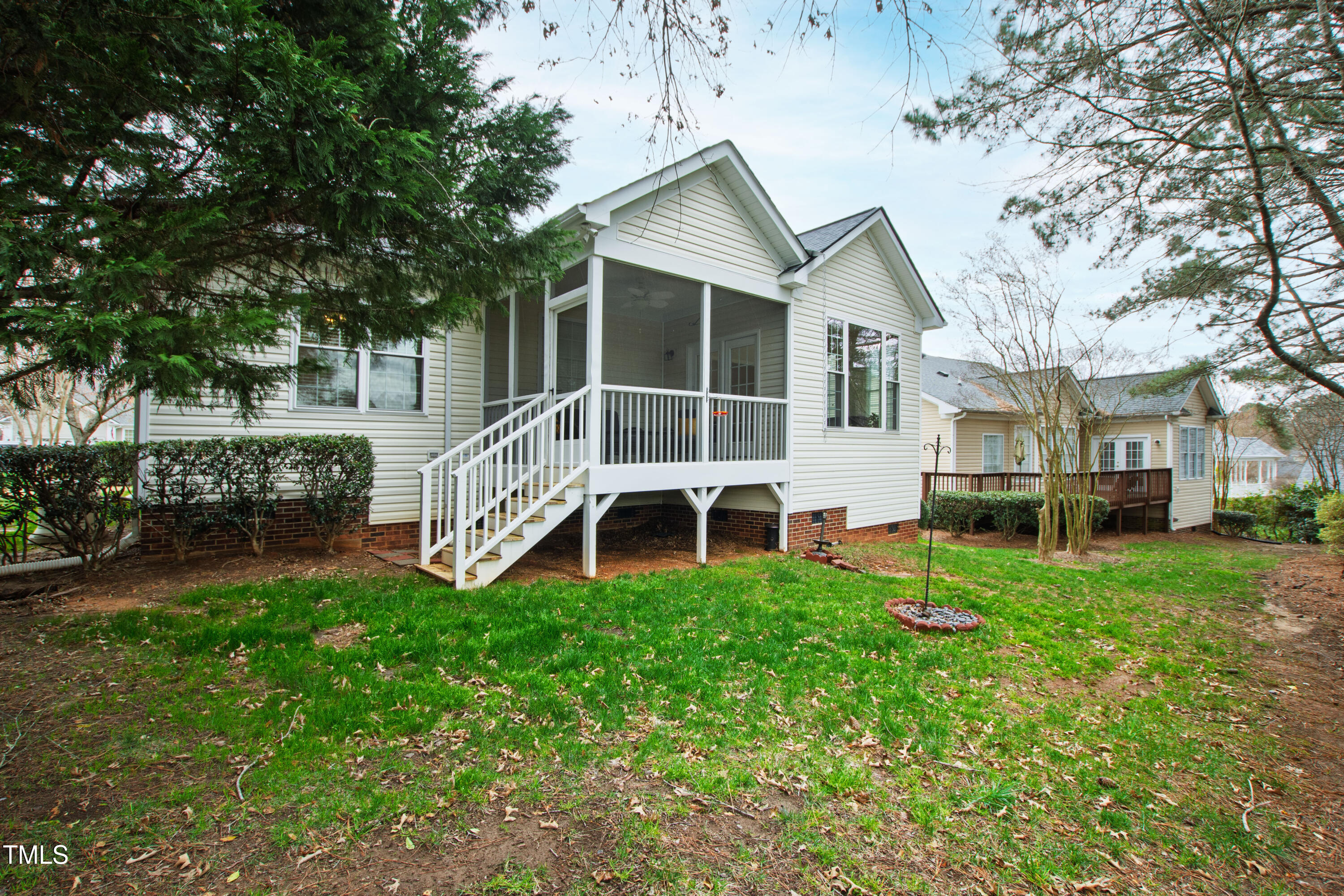 2024 Heritage Pines Drive Cary, NC 27519 - Photo 30 of 31 a view of a house with a yard deck and sitting area