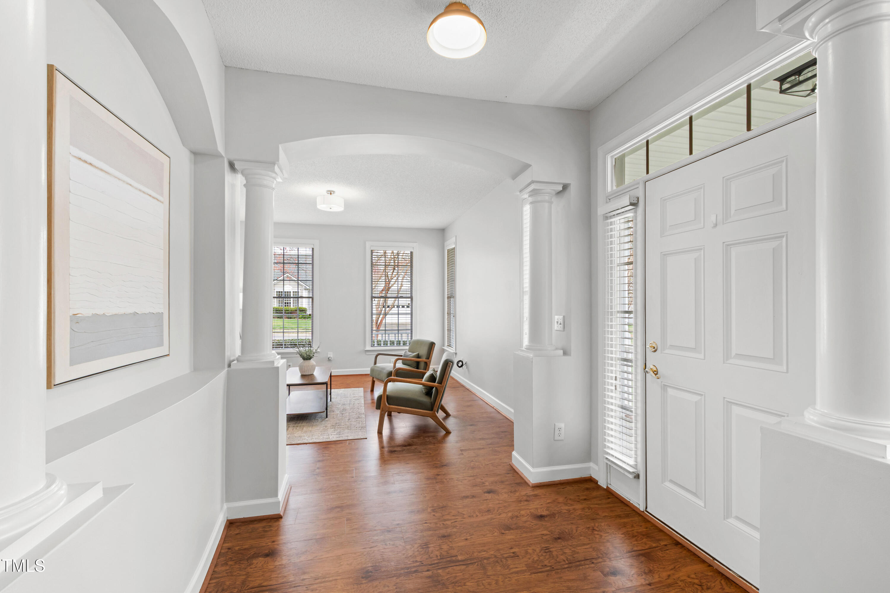 2024 Heritage Pines Drive Cary, NC 27519 - Photo 4 of 31 a view of an empty room with wooden floor and a window