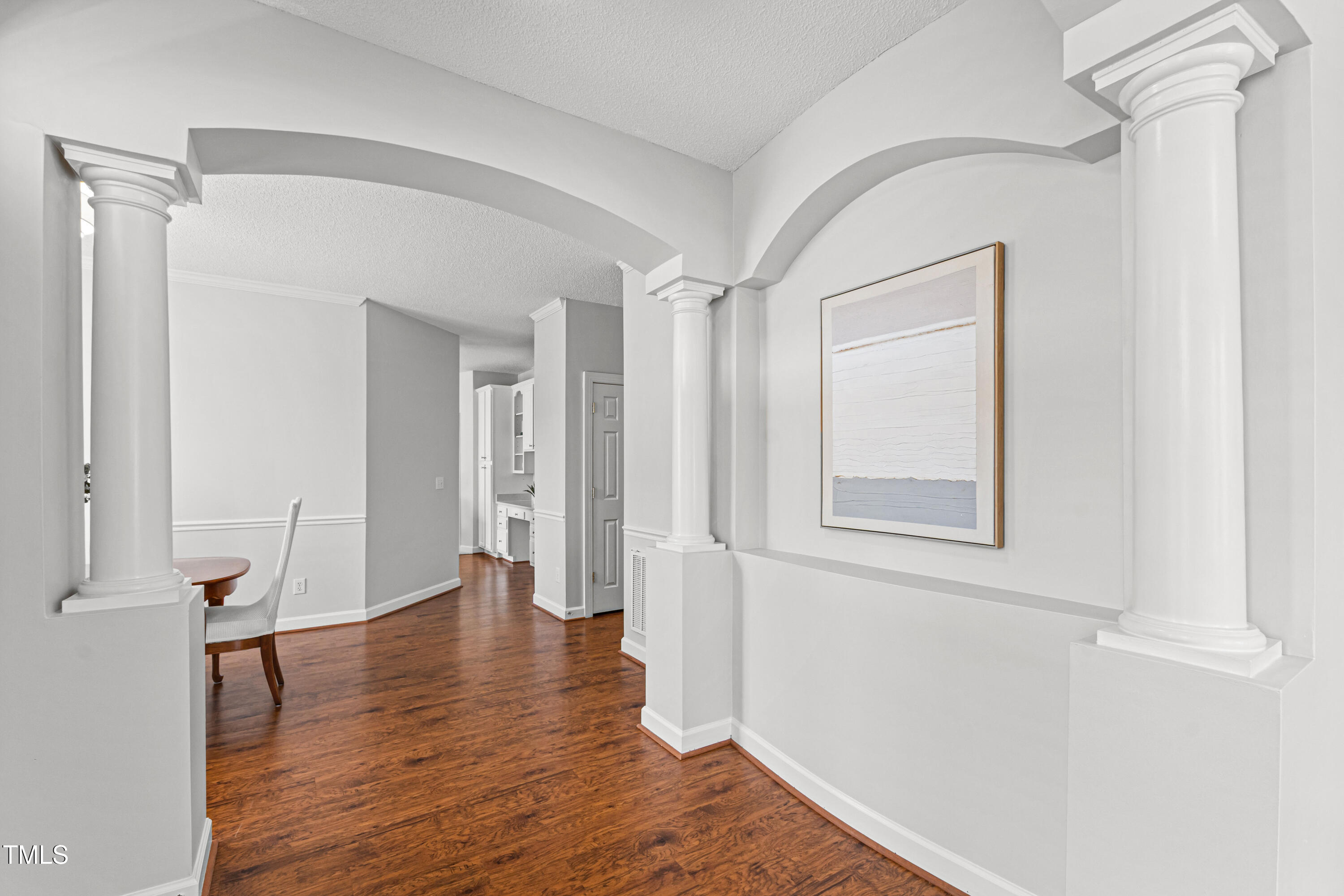 2024 Heritage Pines Drive Cary, NC 27519 - Photo 6 of 31 a view of an empty room with wooden floor and a window