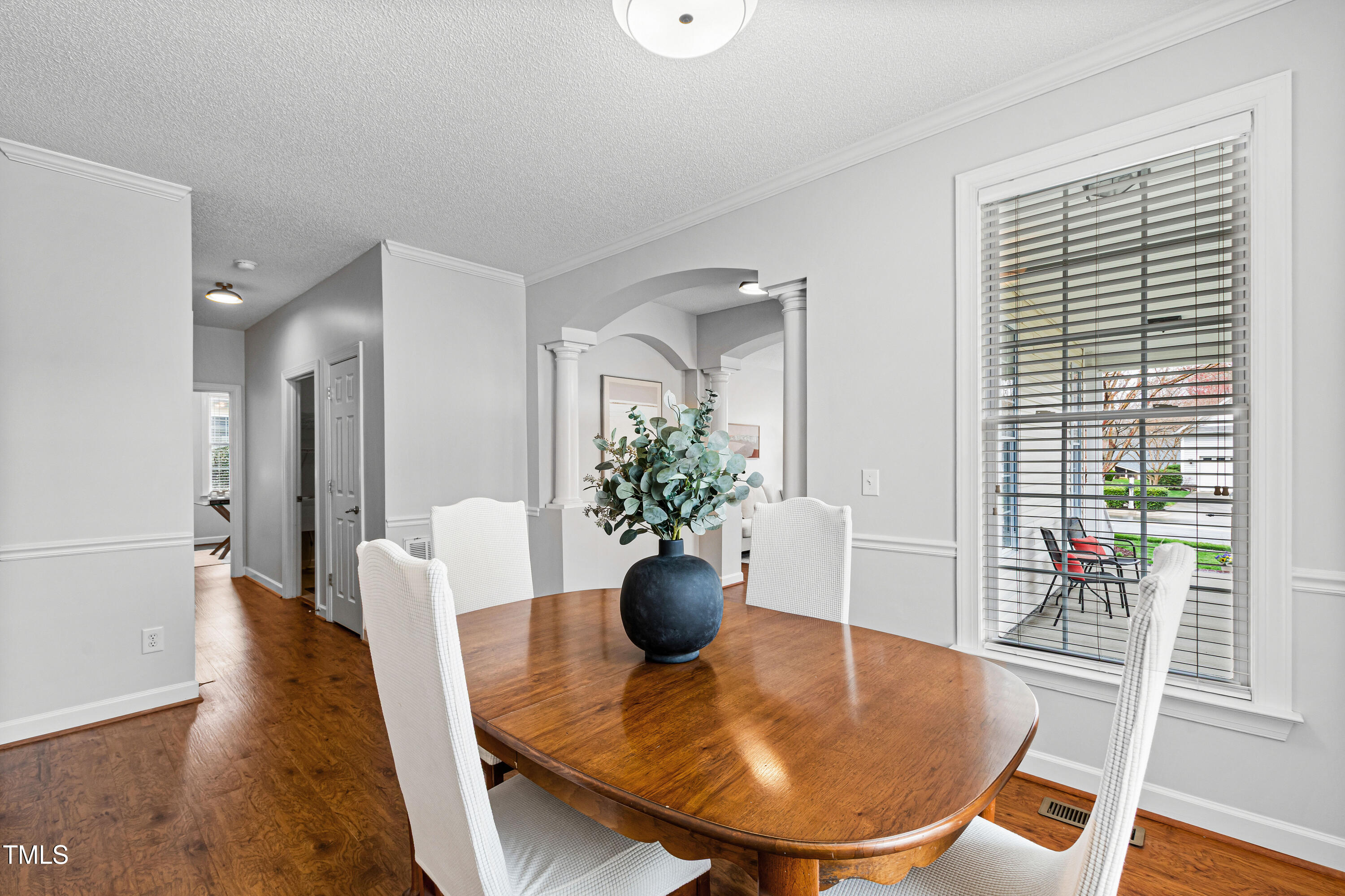 2024 Heritage Pines Drive Cary, NC 27519 - Photo 8 of 31 a view of a dining room with furniture and wooden floor