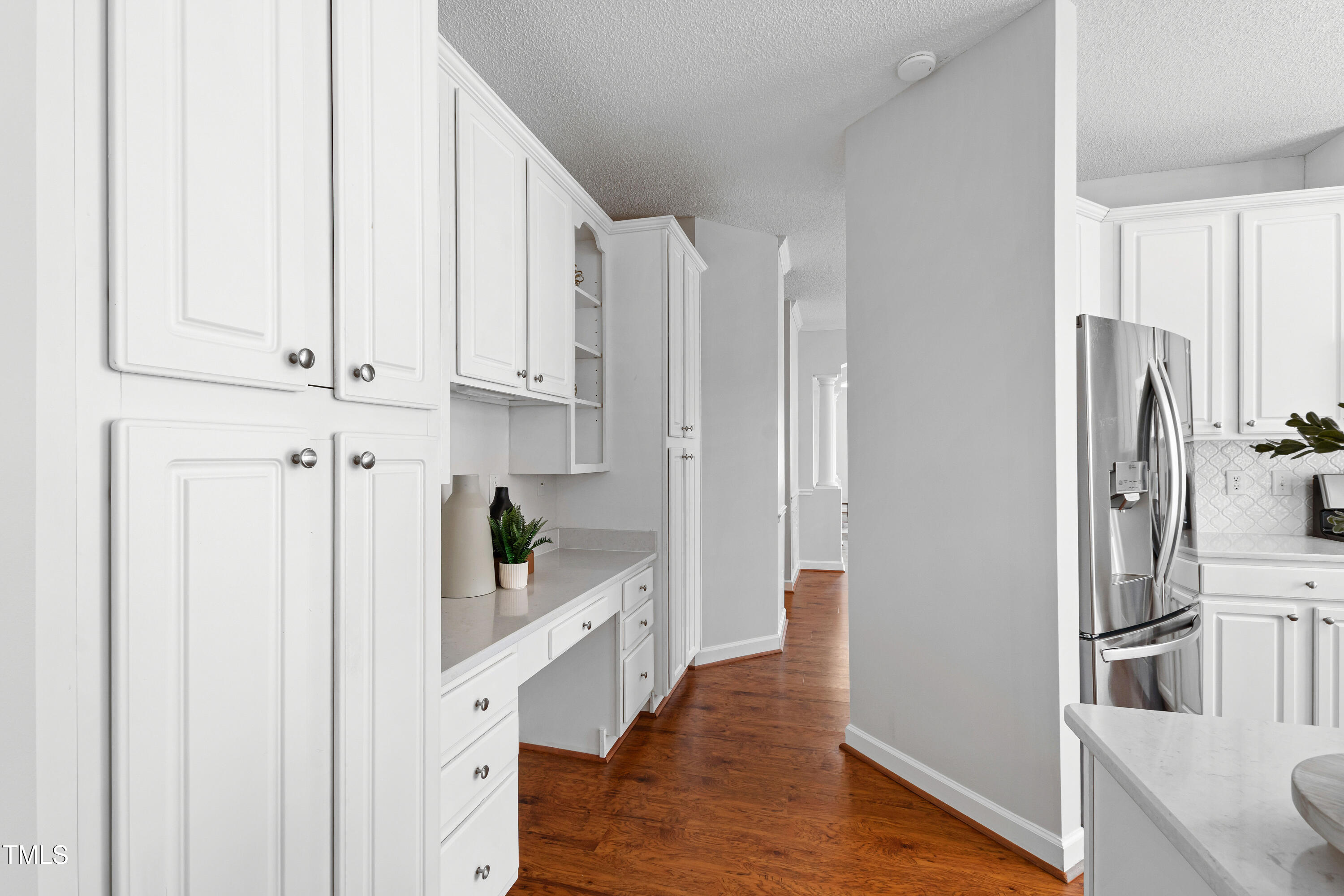 2024 Heritage Pines Drive Cary, NC 27519 - Photo 9 of 31 a kitchen with stainless steel appliances a refrigerator and cabinets