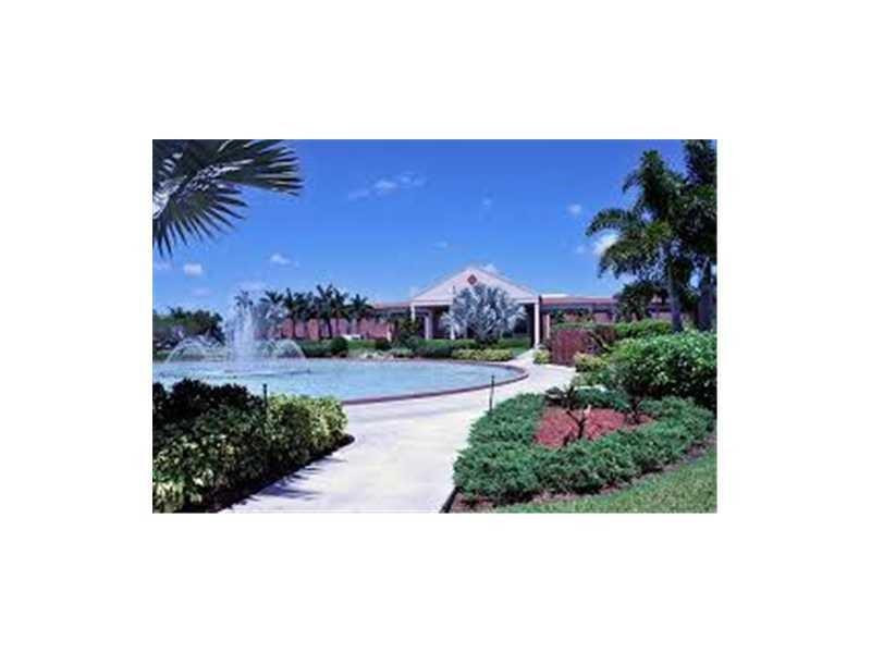 319 Mansfield H, Unit 319 Boca Raton, FL 33434 - Photo 6 of 6 a view of house with a yard