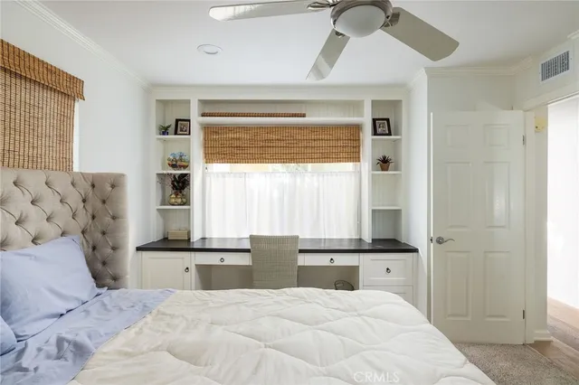 a large bedroom with a large bed and a window