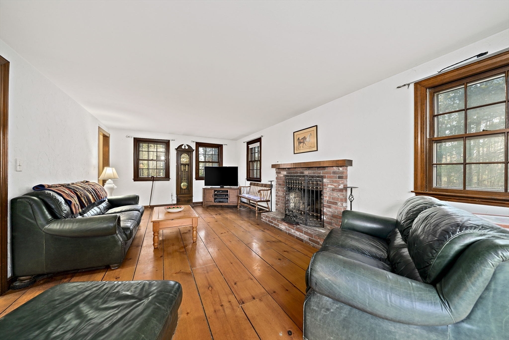 15 Forest Street Plympton, MA 02367 - Photo 11 of 37 a living room with fireplace furniture and a large window