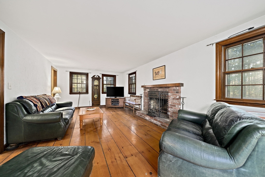15 Forest Street Plympton, MA 02367 - Photo 12 of 37 a living room with fireplace furniture and a large window