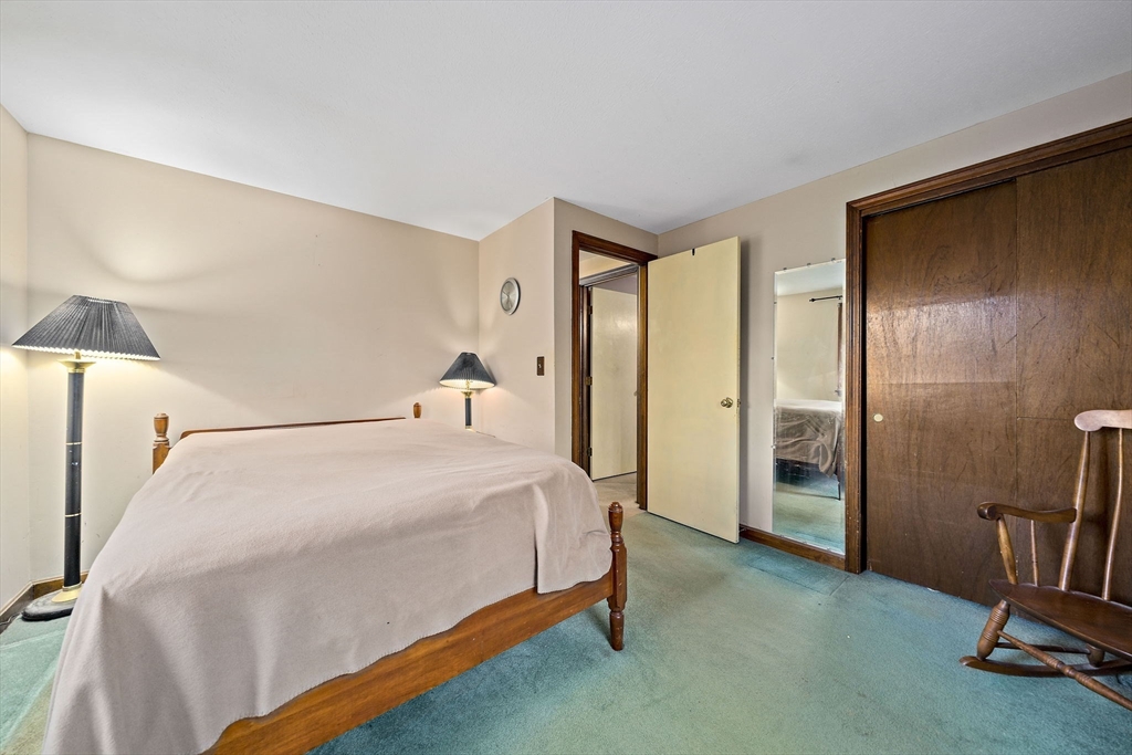 15 Forest Street Plympton, MA 02367 - Photo 19 of 37 a bedroom with a bed and a mirror