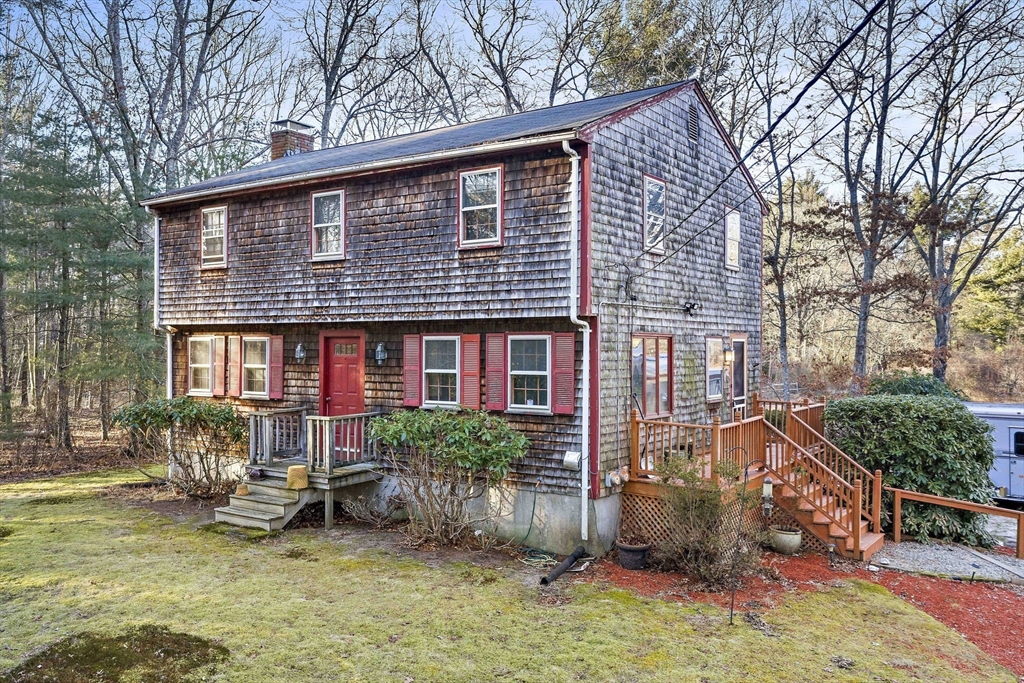 15 Forest Street Plympton, MA 02367 - Photo 2 of 37 a front view of a house with garden