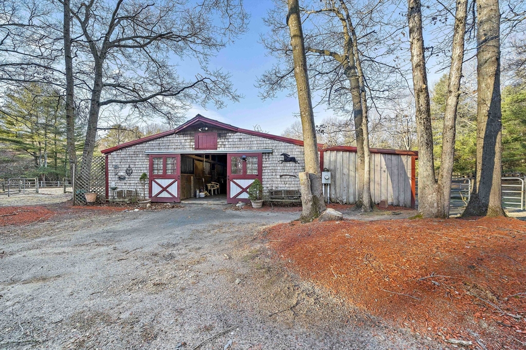 15 Forest Street Plympton, MA 02367 - Photo 25 of 37 a front view of a house with a yard and garage