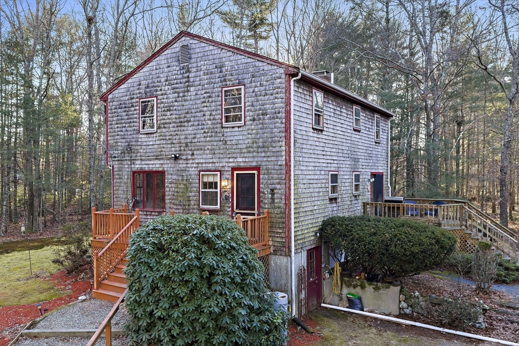 15 Forest Street Plympton, MA 02367 - Photo 4 of 37 a backyard of a house with plants and tree