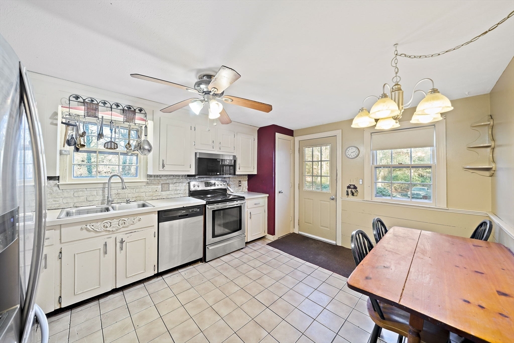 15 Forest Street Plympton, MA 02367 - Photo 6 of 37 a large kitchen with cabinets a sink and appliances