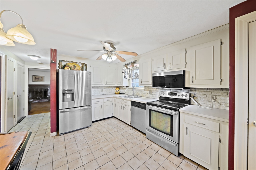 15 Forest Street Plympton, MA 02367 - Photo 7 of 37 a kitchen with white cabinets and appliances